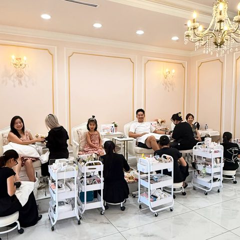 Guests receiving pedicures and manicures on a busy afternoon